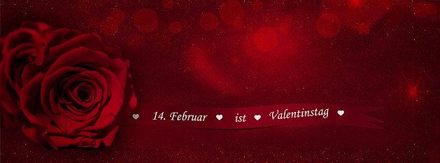 Schriftzug Valentinstag und rote Rosen